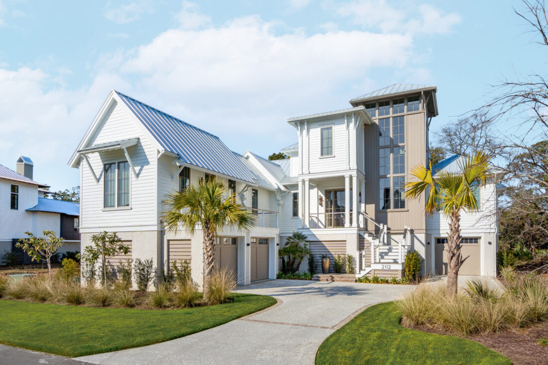 A white house with palm trees