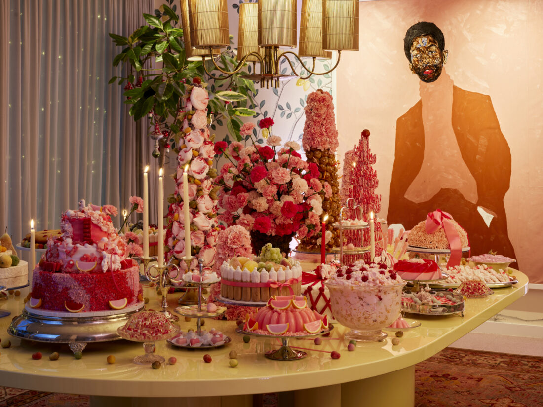 A table set with pink retro desserts