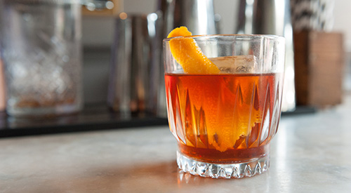 glass of bourbon with ice