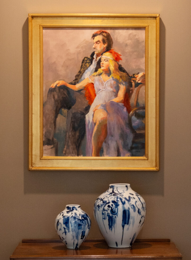 A painting of a couple on a wall