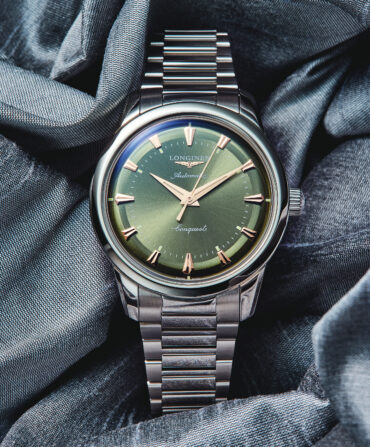 A watch with a green face