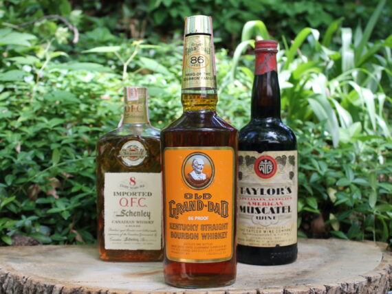 Bottles of bourbon on display a stump