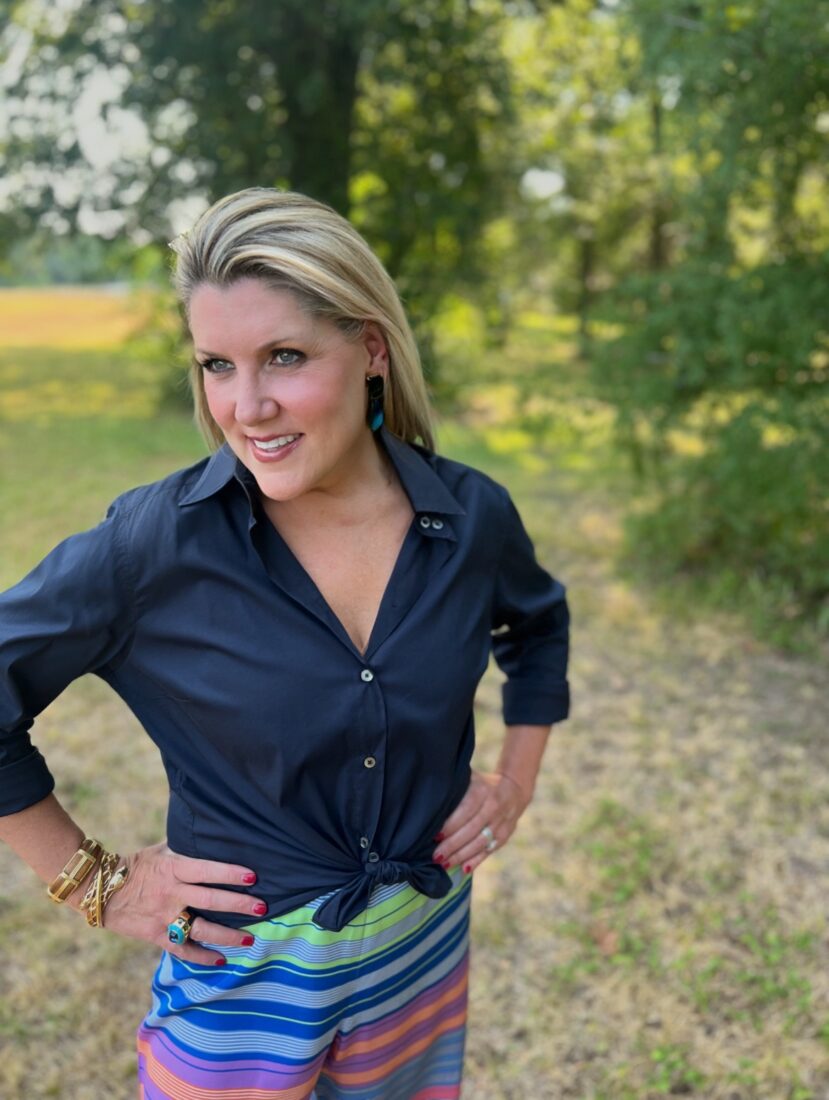 A portrait of a woman standing outside
